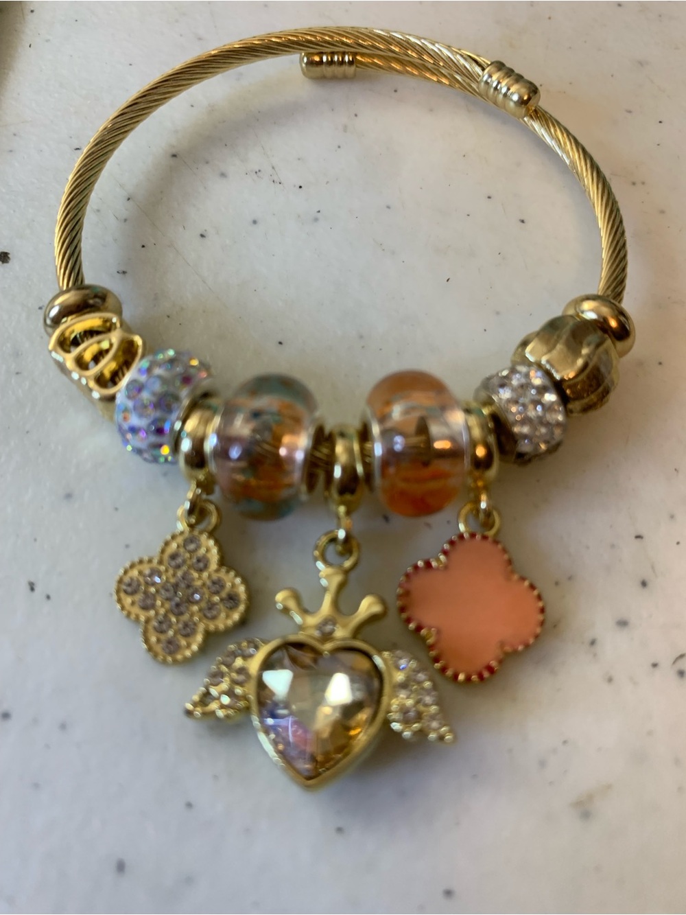 Gold-Tone Charm Bracelet with Pink and Iridescent Accents